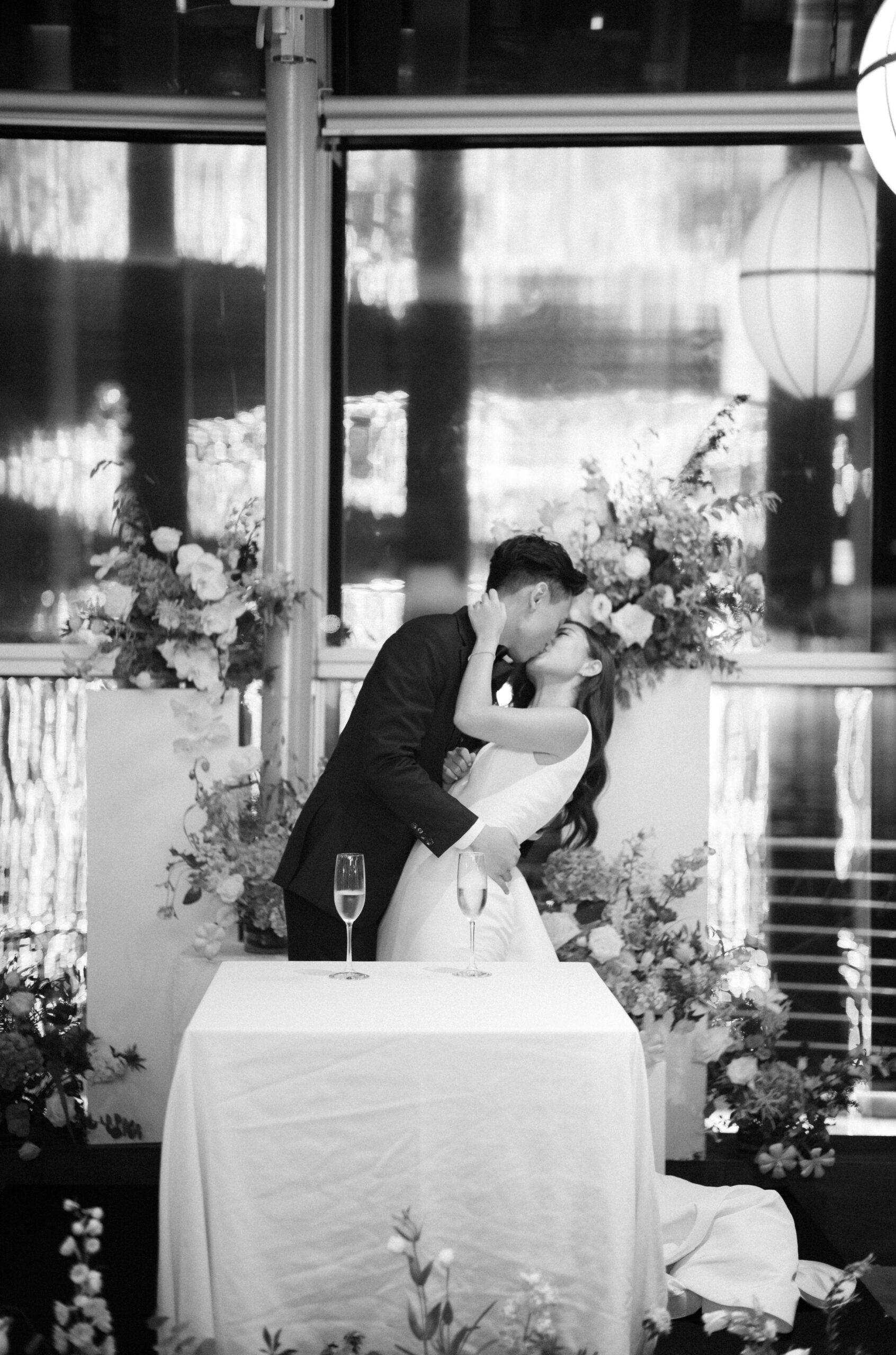Bride and Groom kissing passionately during reception